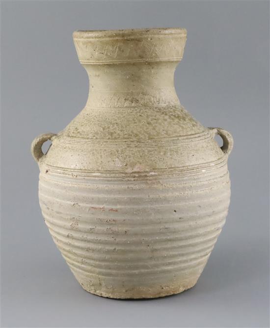 A Chinese pale green glazed jar, Han dynasty, H. 24.5cm